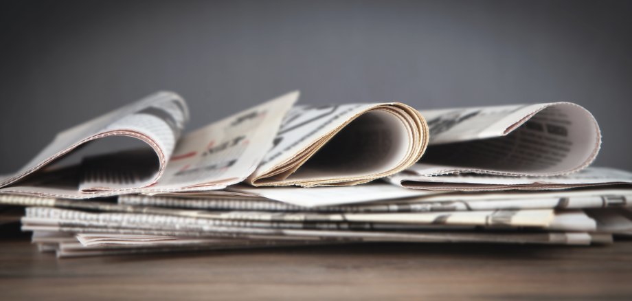 Newspapers on the wooden table